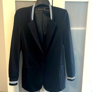 Black long and lean blazer.